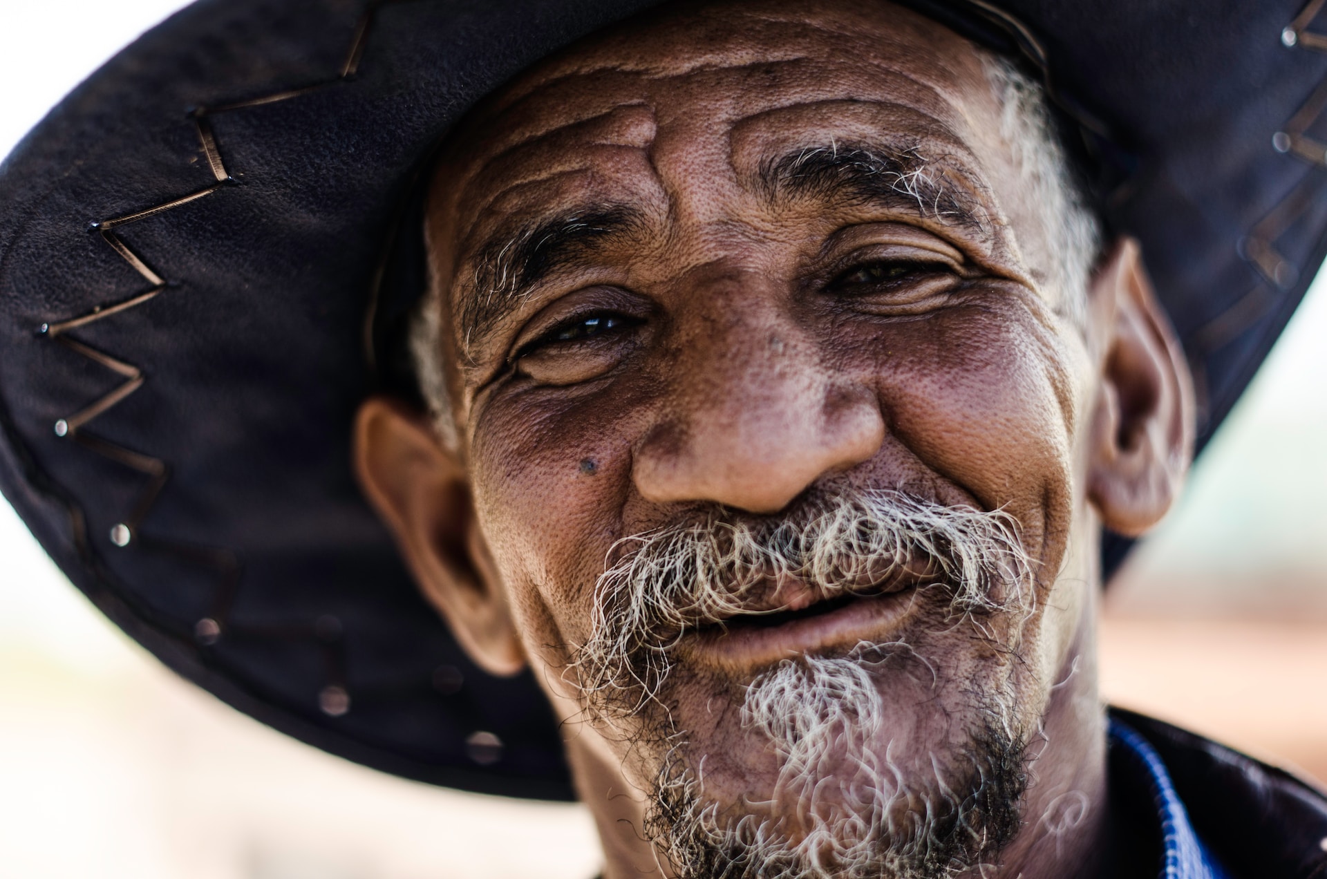 Old cowboy face with small beard